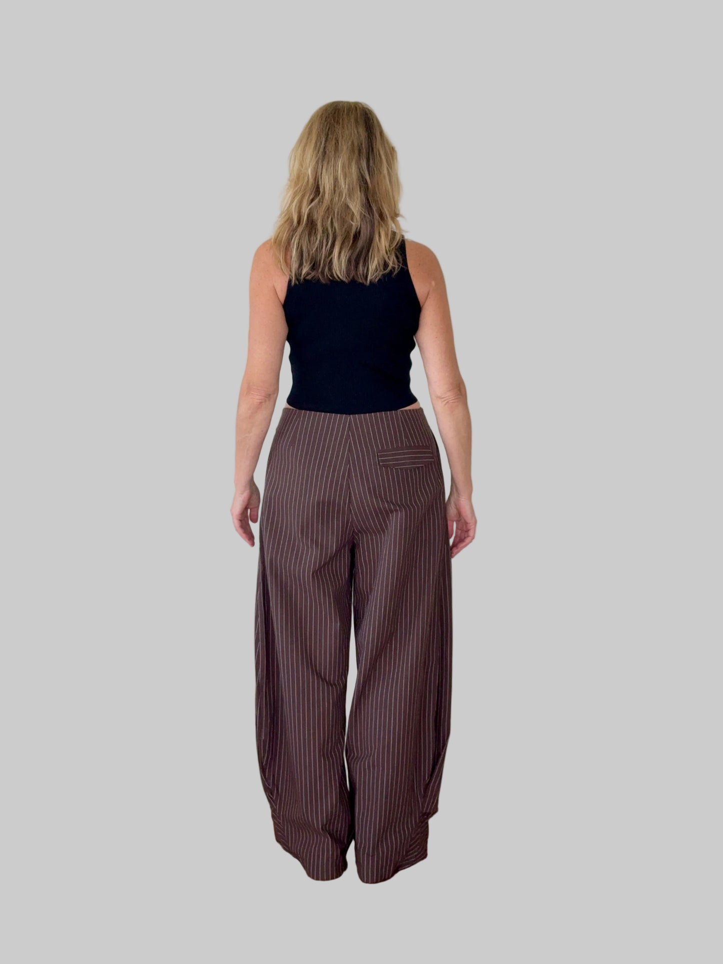 Black high neck tank top styled with wide leg pants - women's fashion Australia - Cheeky Goddess