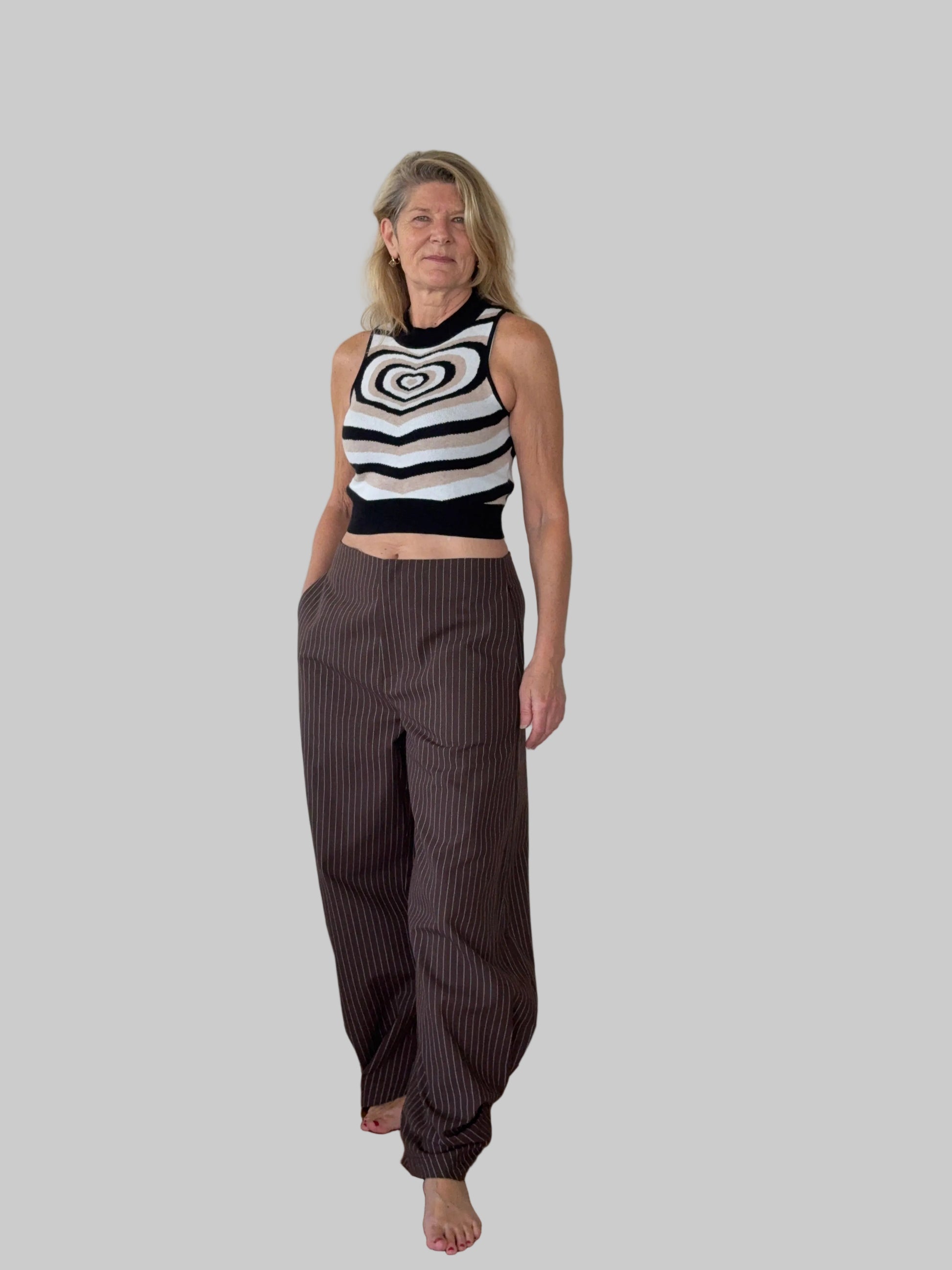 Sleeveless heart print knit top styled with pinstripe pants - smart casual women Australia - Cheeky Goddess