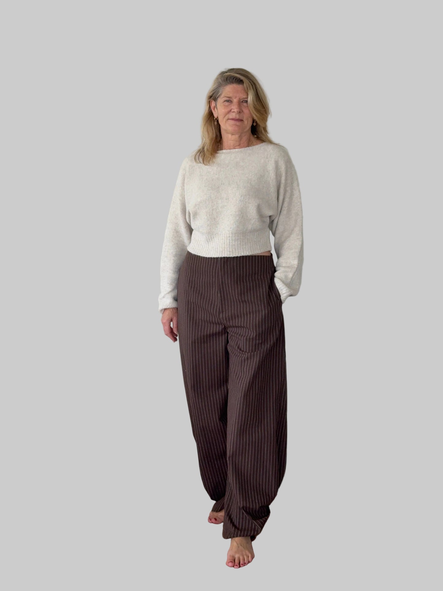 Oversized oatmeal colored batwing knit top with boat neck - women - styled with brown barrel pants - frontt view - Cheeky Goddess Australia