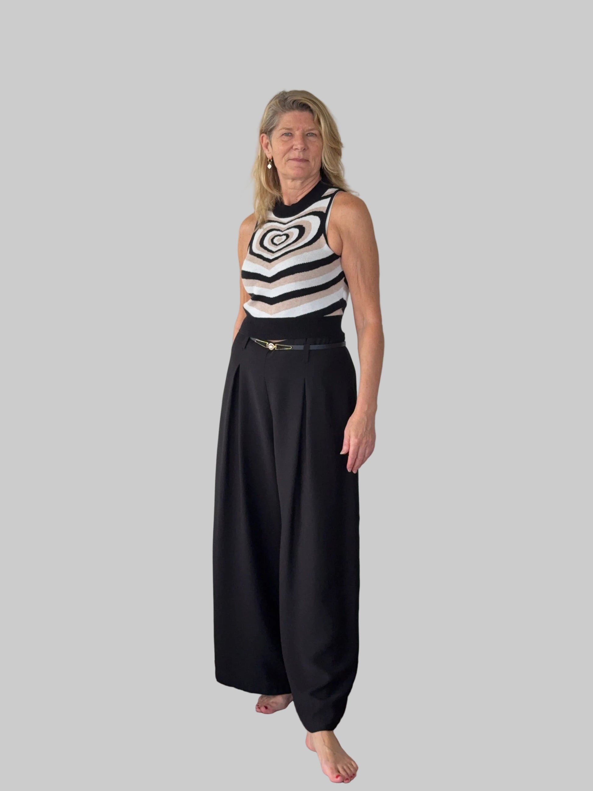 Black flowy wide leg pants women - front view - pleated detail - with belt and geometric knit tank top - Cheeky Goddess Australia