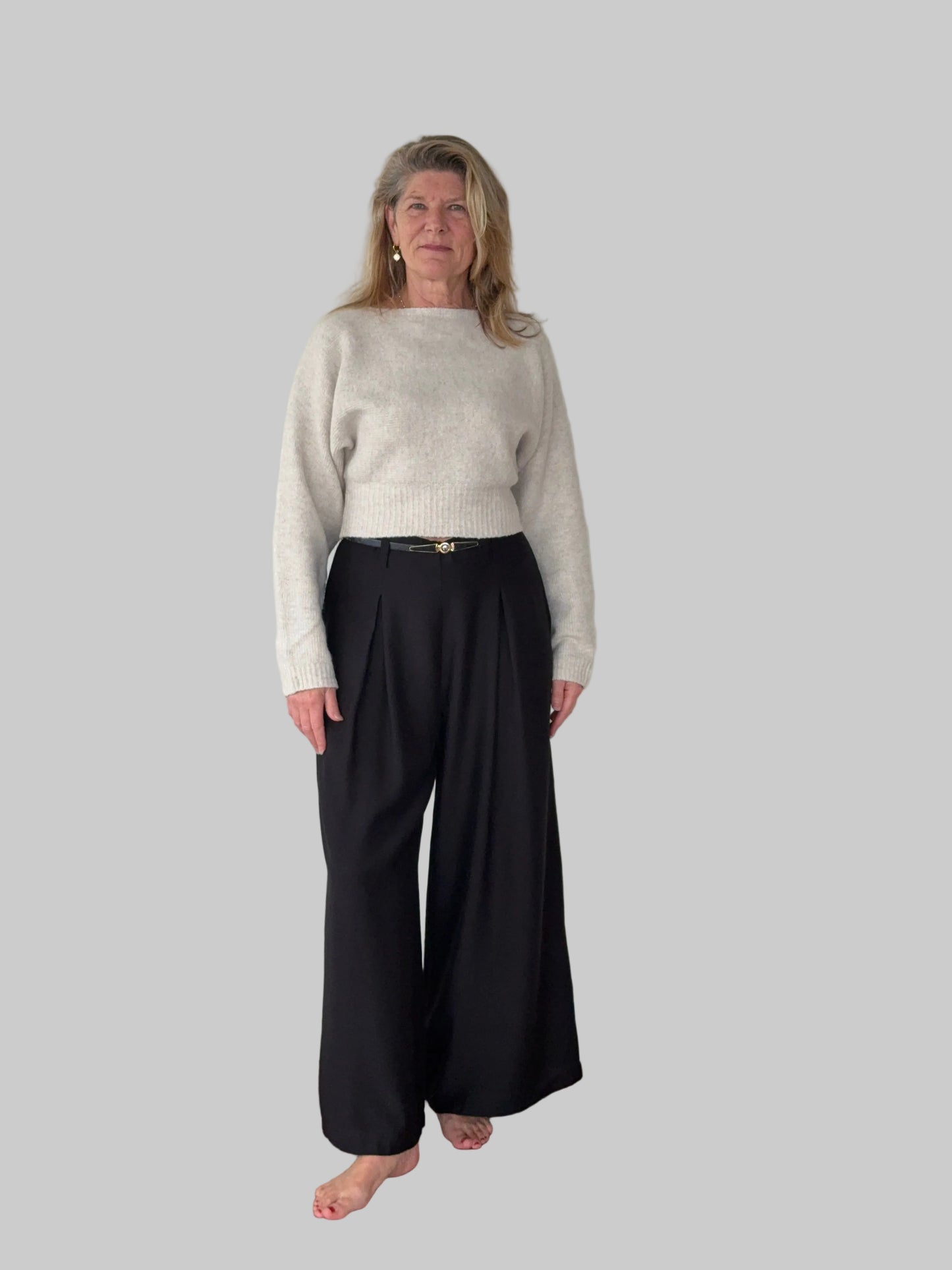 Black flowy wide leg pants women - front view - pleated detail -with belt and oatmeal long sleeved knit top - Cheeky Goddess Australia