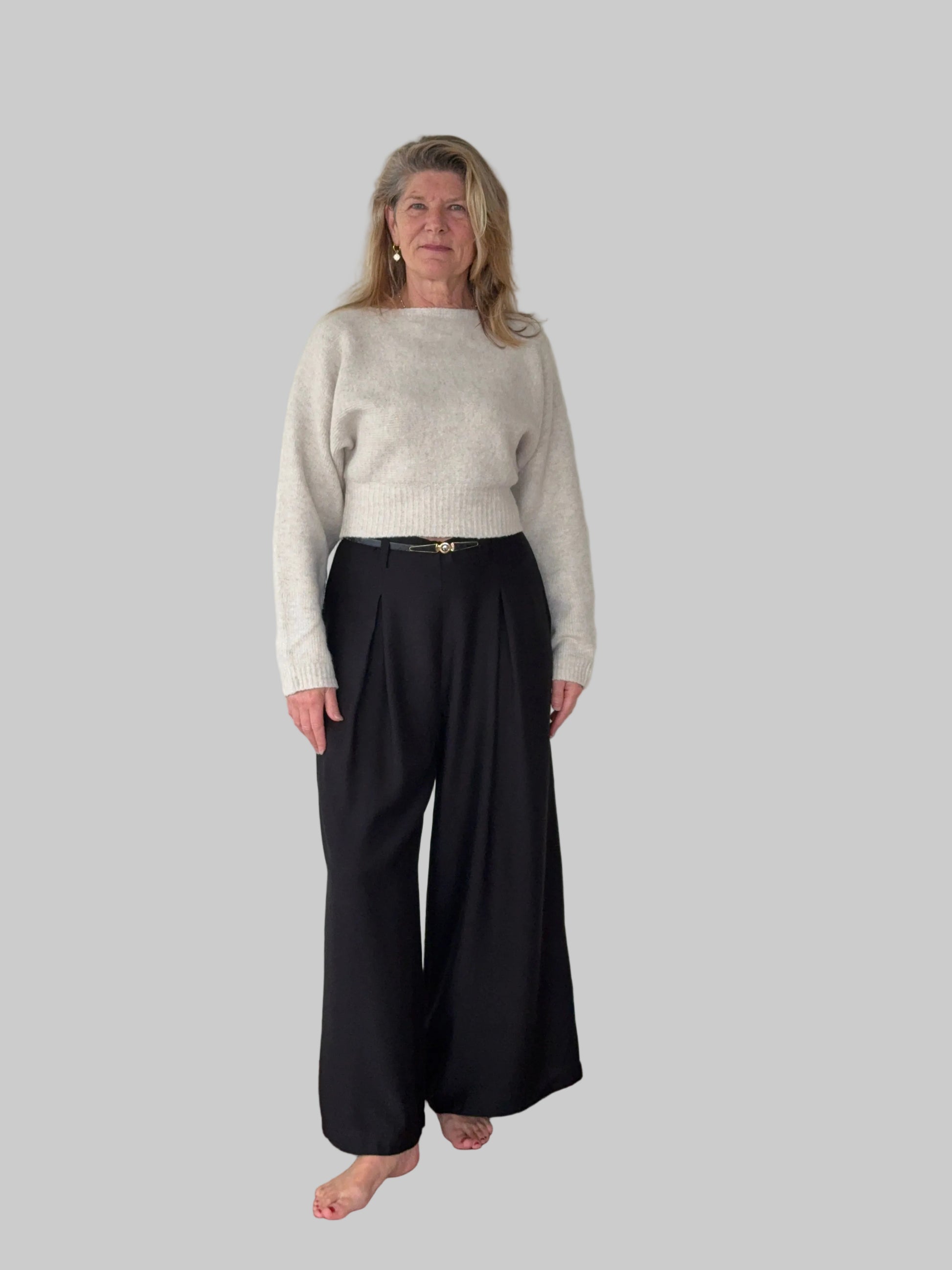 Black flowy wide leg pants women - front view - pleated detail -with belt and oatmeal long sleeved knit top - Cheeky Goddess Australia