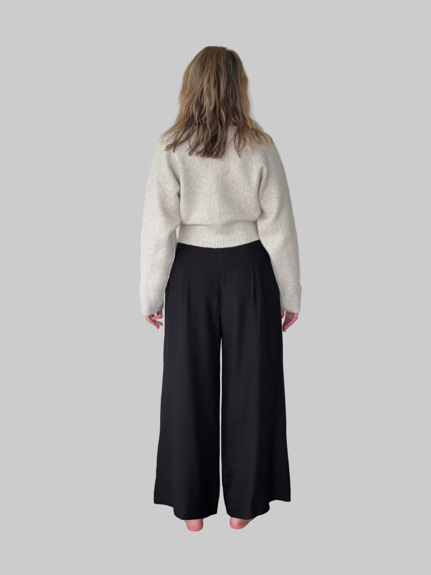 Black flowy wide leg pants women - back view - pleated detail - with oatmeal long sleeved knit top -Cheeky Goddess Australia