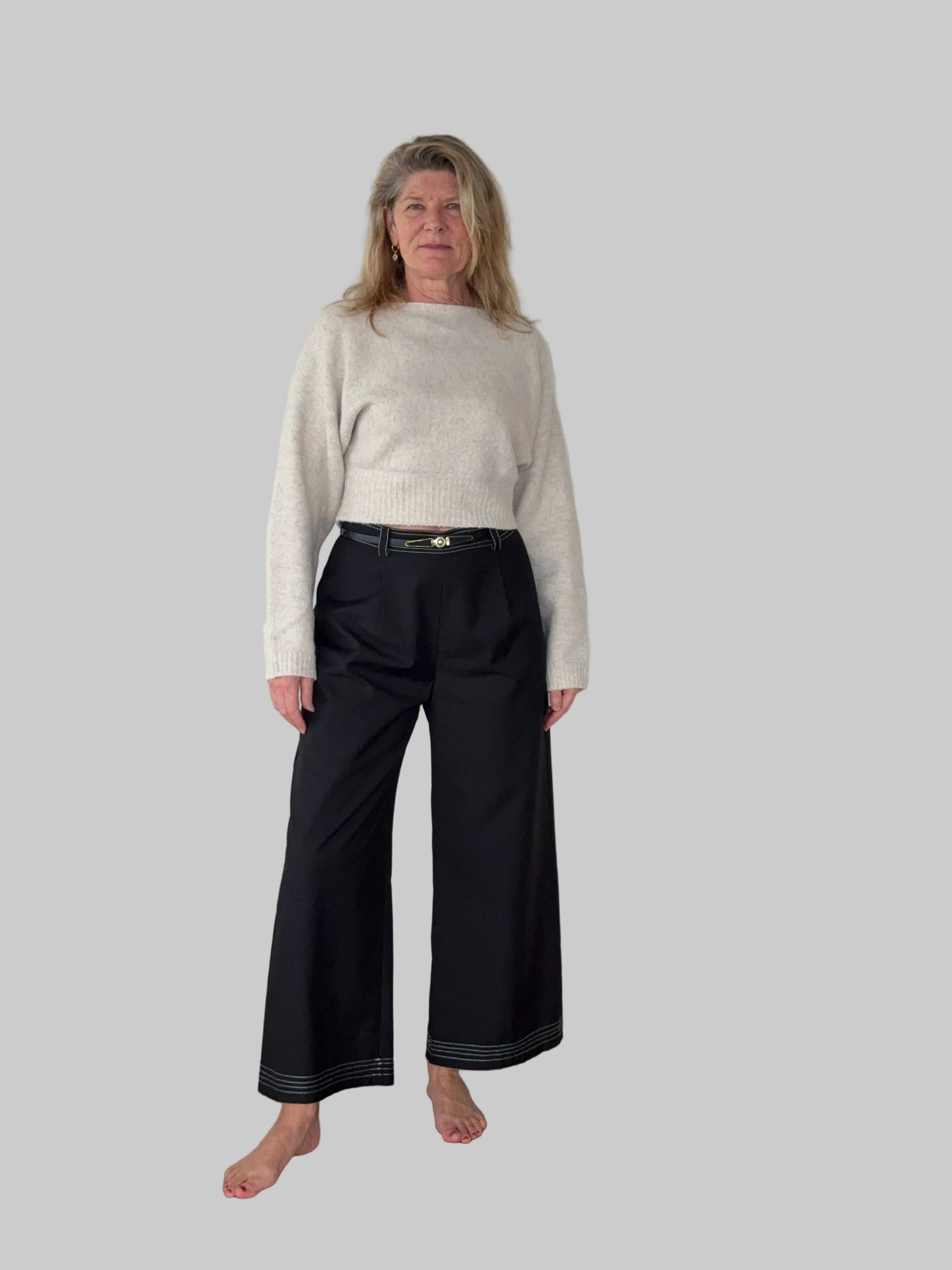 Black wide leg pants with contrast white stitching women Australia - front view - with belt and oatmeal long sleeved knit top - Vida size 14 - Cheeky Goddess