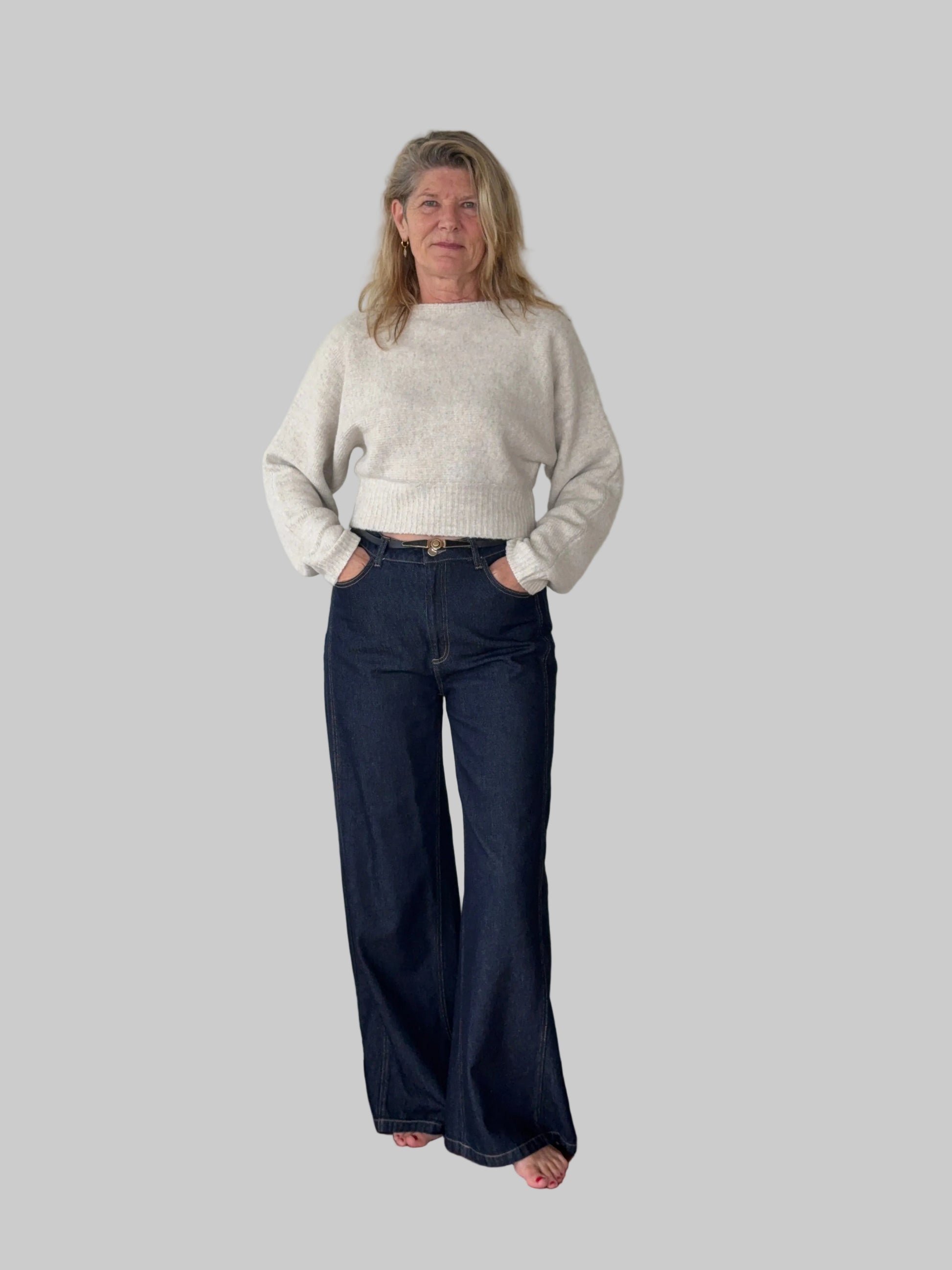 Oversized oatmeal colored batwing knit top with boat neck - women - styled with dark blue denim jeans - front view - Cheeky Goddess Australia