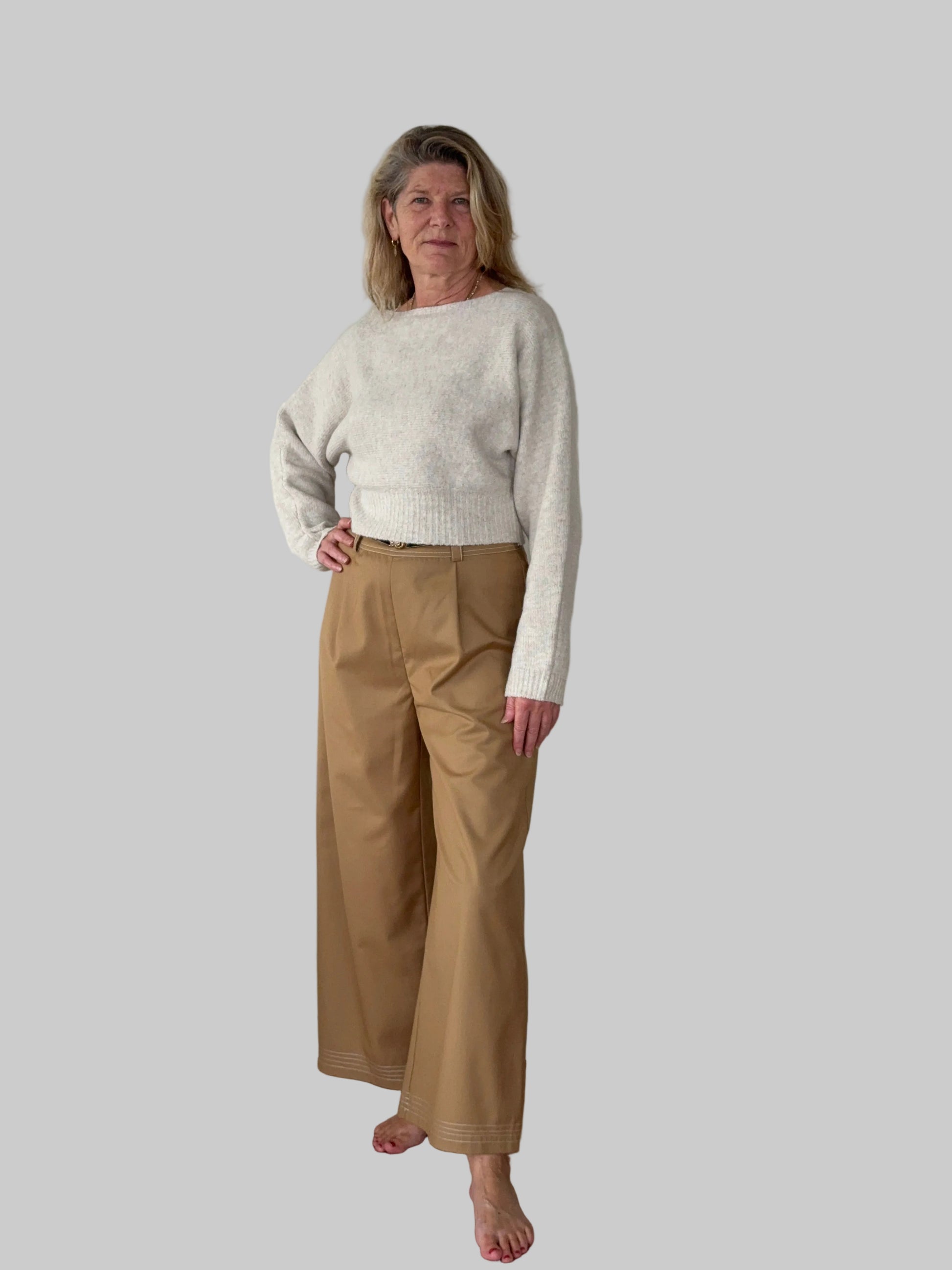 Oversized oatmeal colored batwing knit top with boat neck - women - styled with mocha wide leg pants - front view - Cheeky Goddess Australia