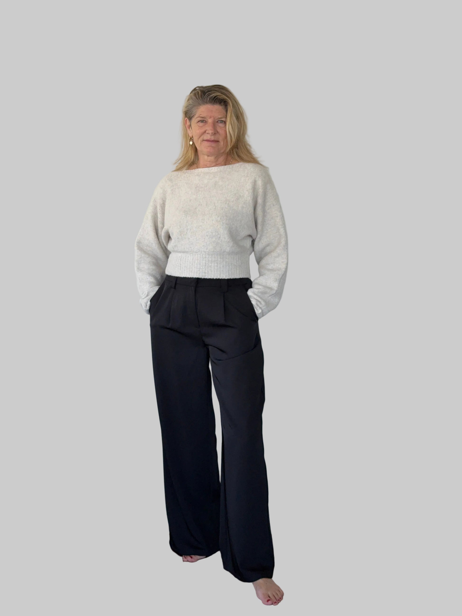 Oversized oatmeal colored batwing knit top with boat neck - women - styled with black wide leg pants - front view - Cheeky Goddess Australia