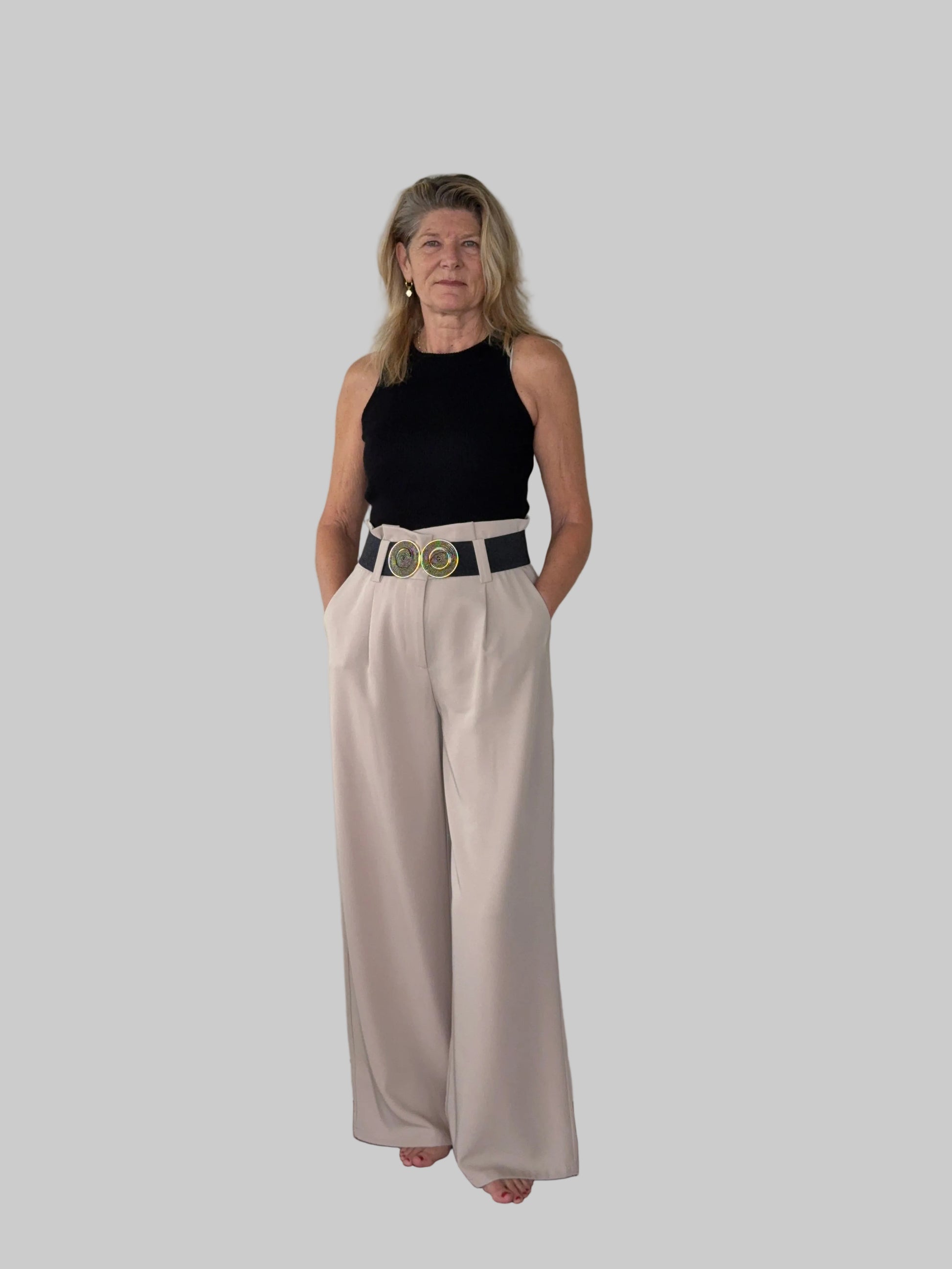 Beige paper bag waist pants women - front view - flattering wide leg - with wide belt and black tank top - Cheeky Goddess Australia