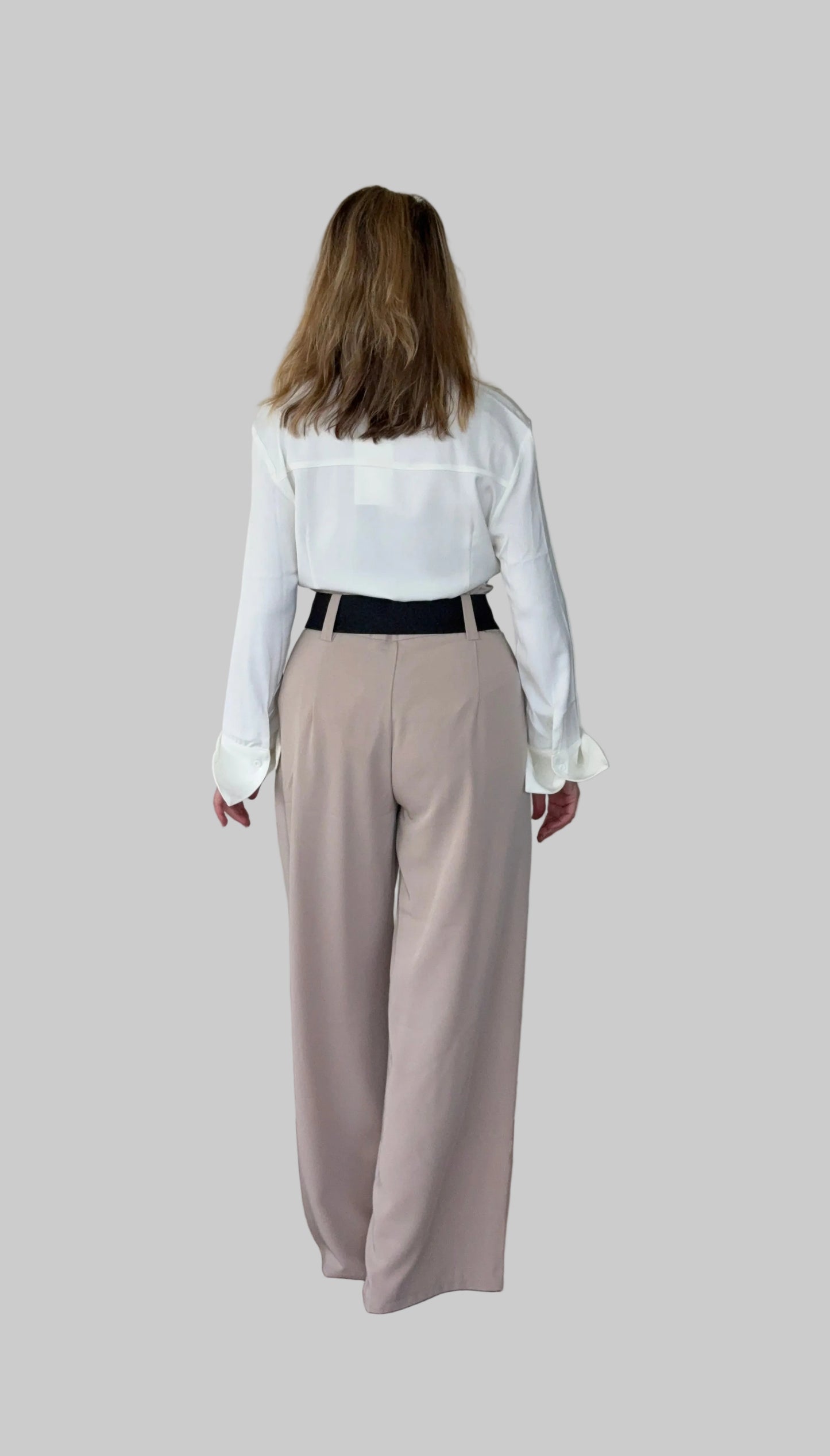 White long sleeve shirt women Australia - doesn't show sweat. Flare cuff, cinched waist. Tucked into brown pants with wide belt.  Back view. Tested in real life. Cheeky Goddess. Beige paper bag waist pants women - flattering wide leg - Australia