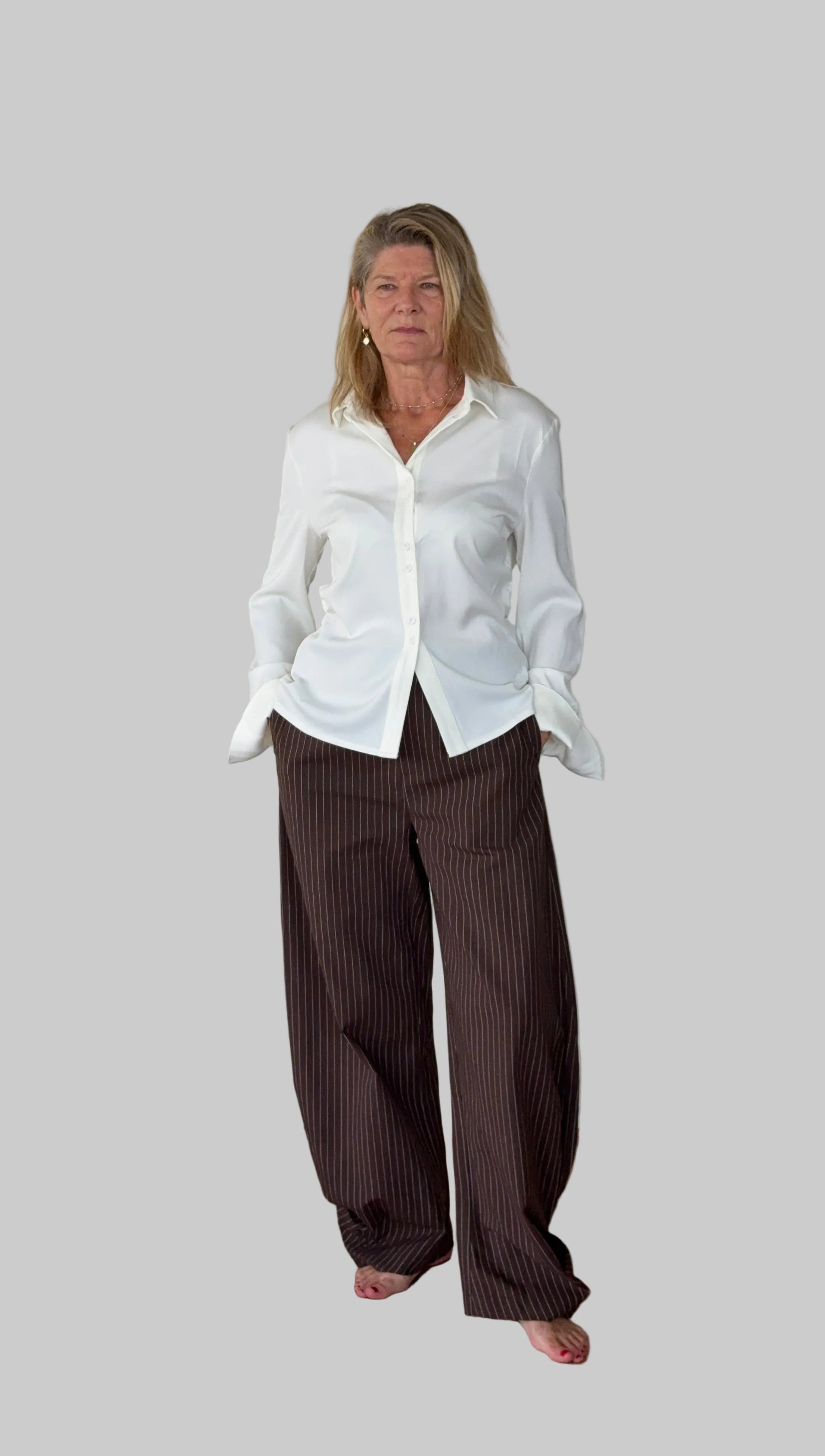 Brown linen pants styled with white shirt - women over 50 Australia - Cheeky Goddess