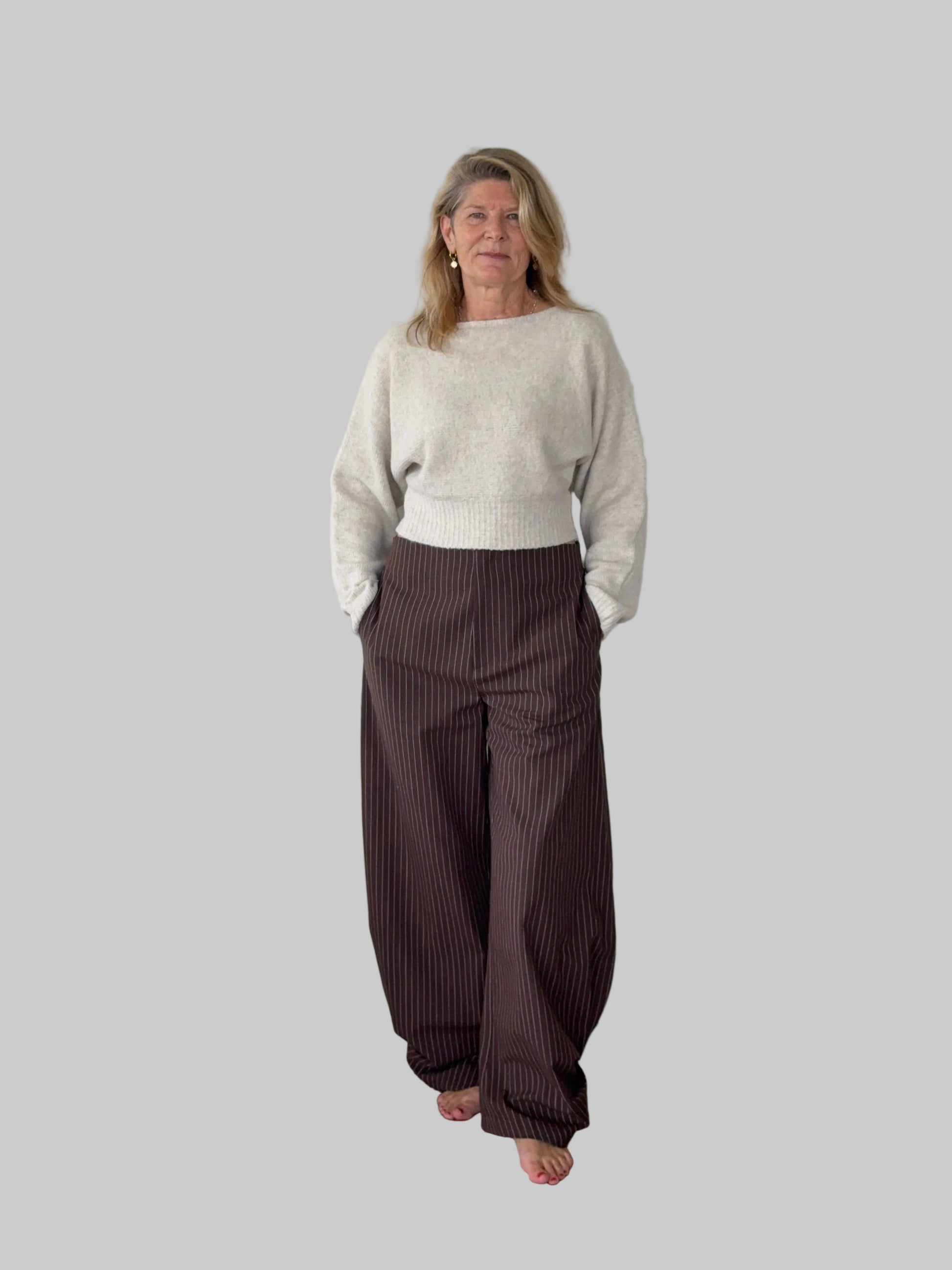 Brown linen pants styled with cream knit long sleeved top - women over 50 Australia - Cheeky Goddess