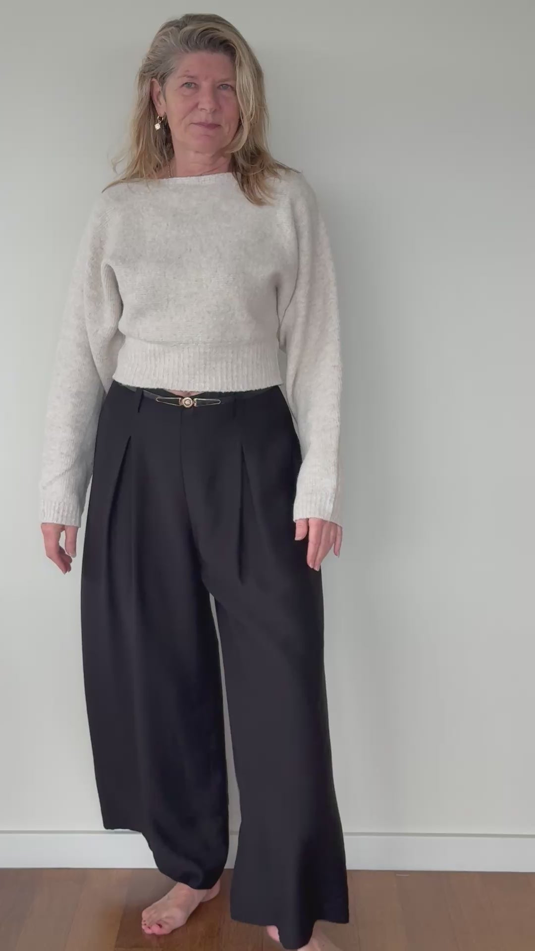 Video of woman showing black flowy wide leg pants with thin belt with oatmeal long sleeved knit top.  Size 14 - women - Cheeky Goddess - Australia