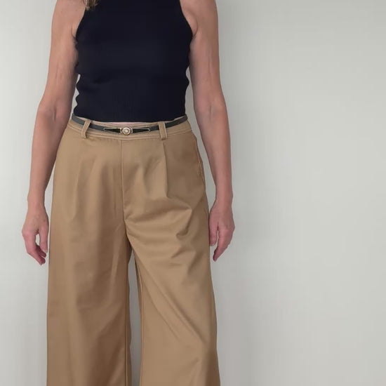 Video of woman in mocha brown wide leg pants with white stitching - with black belt and black knit tank top.  Cheeky Goddess - Vida - size 14 - Australia