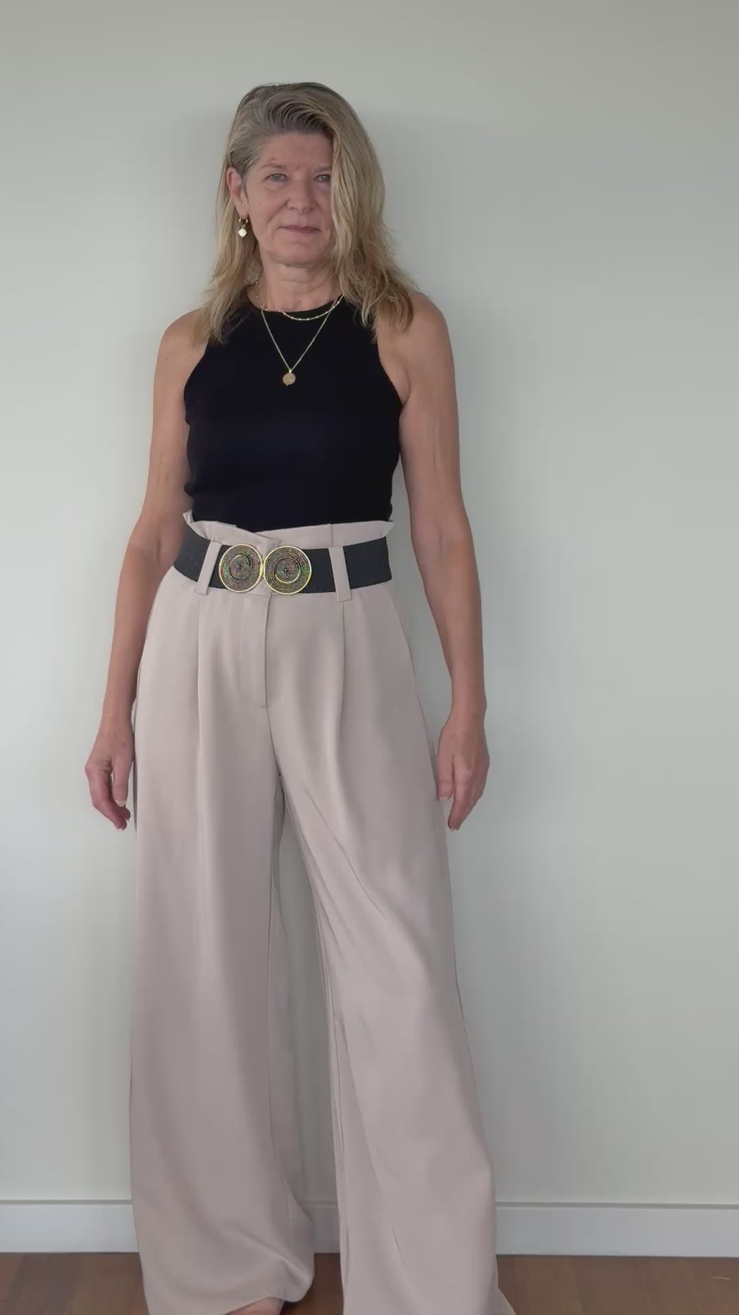 Video of woman in black knit tank top with beige wide leg tailored pants with black belt.  Cheeky Goddess - Vida size 14 Australia