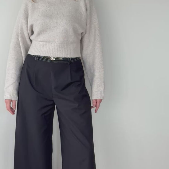 Video of woman in black wide leg pants with white contrast stitching - with belt and oatmeal colored long sleeved knit top - Cheeky Goddess - size 14 - Vida - Australia